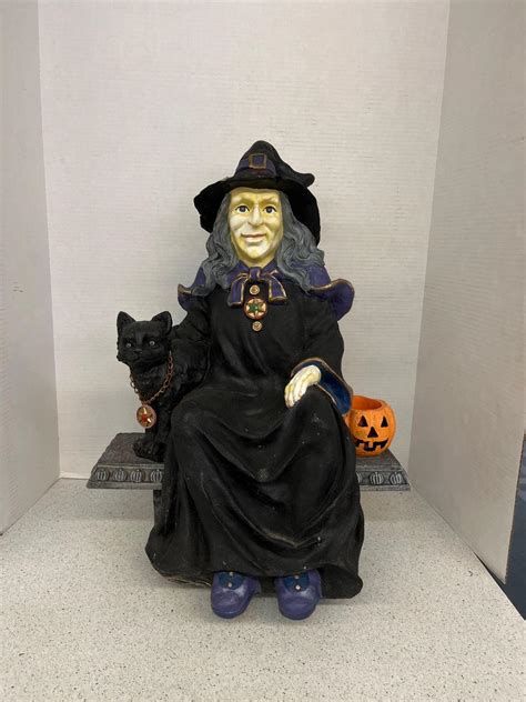 Transforming your home into a haunted mansion: Seated witch robot included